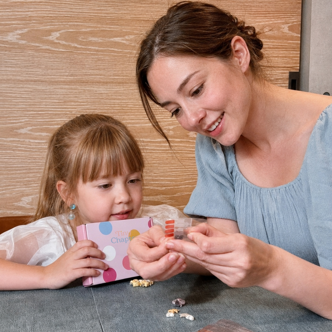 Mother and daughter exploring Tiny Chapter earrings together
